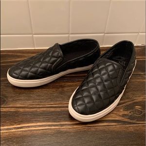 Woman’s black slip on quilt print sneakers 6.5